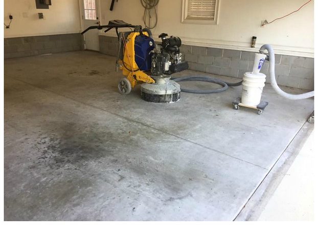 Concrete grinding and repair in progress