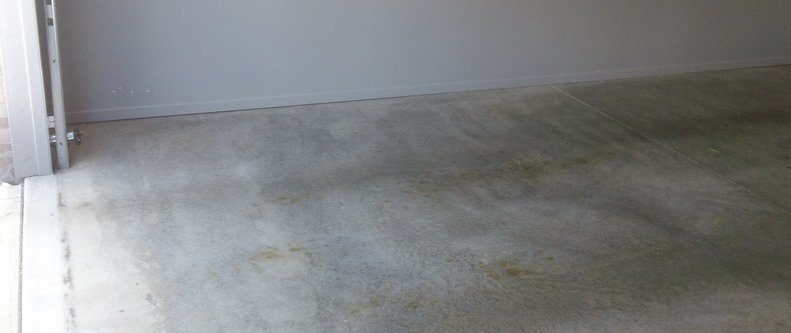 Before: worn concrete garage floor